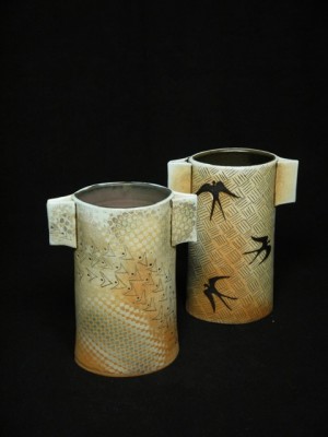 Marsha Slater’s “Kimono Vases” are wheel-thrown porcelain, altered, incised with black underglaze (mishima technique) and painted overlay designs, sprayed with flashing slips and glazes for final firing, fired to cone 10 in soda kiln
