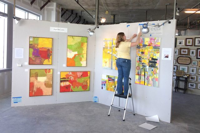 Gallery 3 - An artist installing her work at Artomatic.
