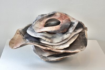 Julie Zirlin’s “Wave Vessel” is an undulating ceramic piece.