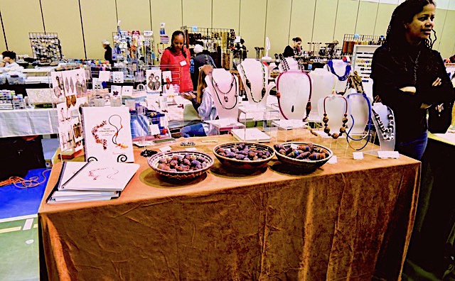 A booth at the Bead Bazaar sells ‘how to” books, Nzizza beads and jewelry.