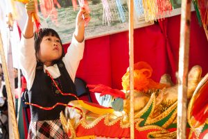A young girl enjoys the dragon in the China tent at the World of Montgomery Festival. 