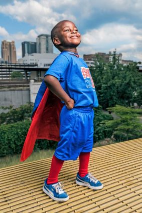 Austin’s power: Showing love. Austin Perine, 4, feeds the homeless in Birmingham, Alabama and beyond. Most of the time, he wears his superhero cape.