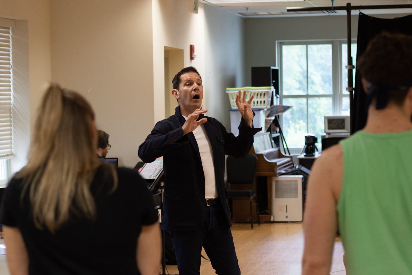 Director Peter Flynn in rehearsal with the young ensemble cast of “Roald Dahl’s Matilda the Musical” at Olney Theatre Center.