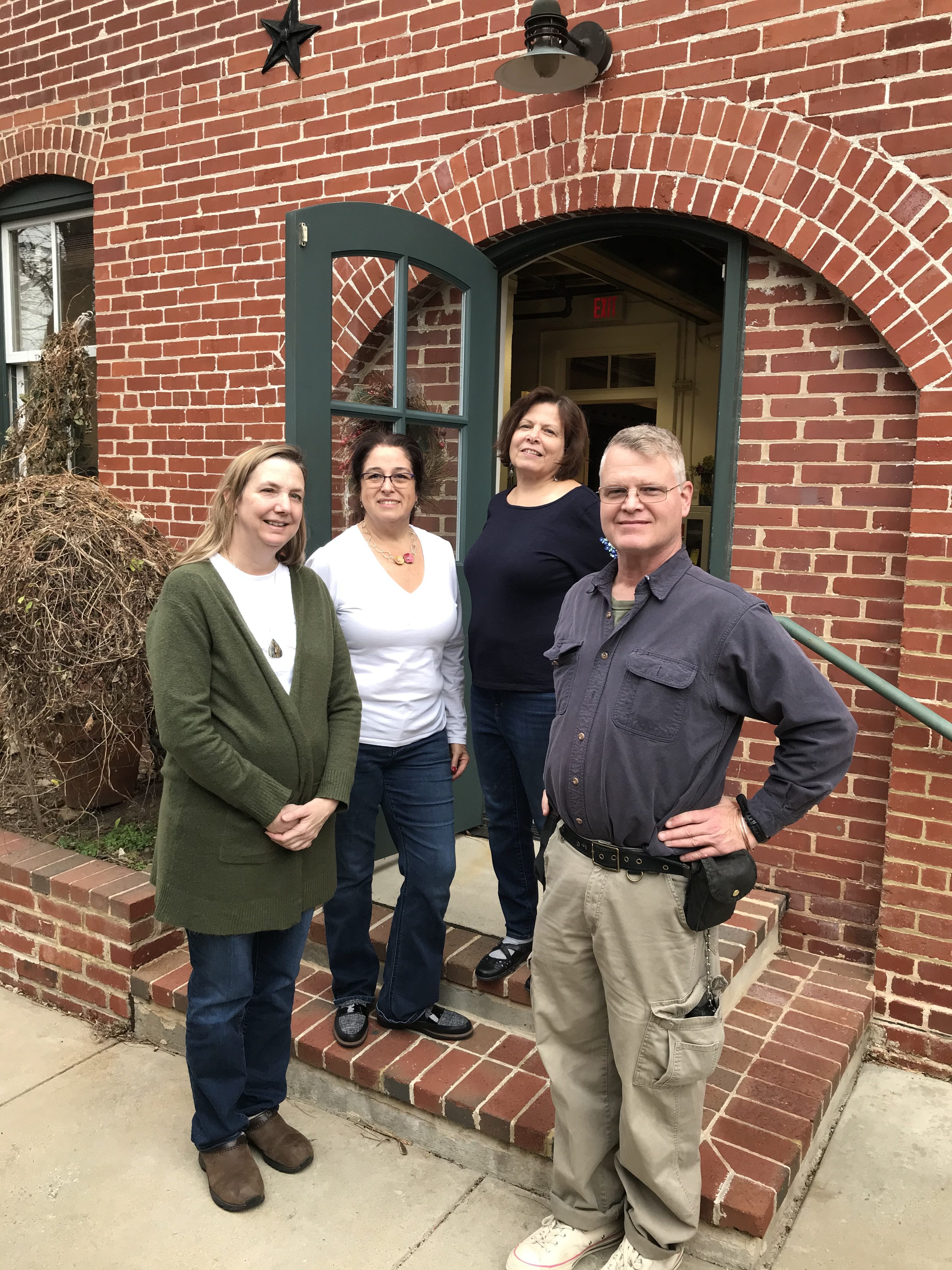 Portrait of the artists: from left, Jarree Donnelly, Maritza Suárez-Valenti, Jeanne Sullivan and Jack Donnelly pose in front of the Arts Barn.